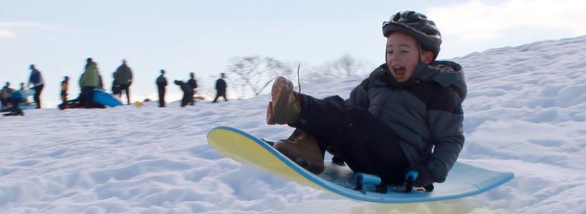 a boy on a snowboard